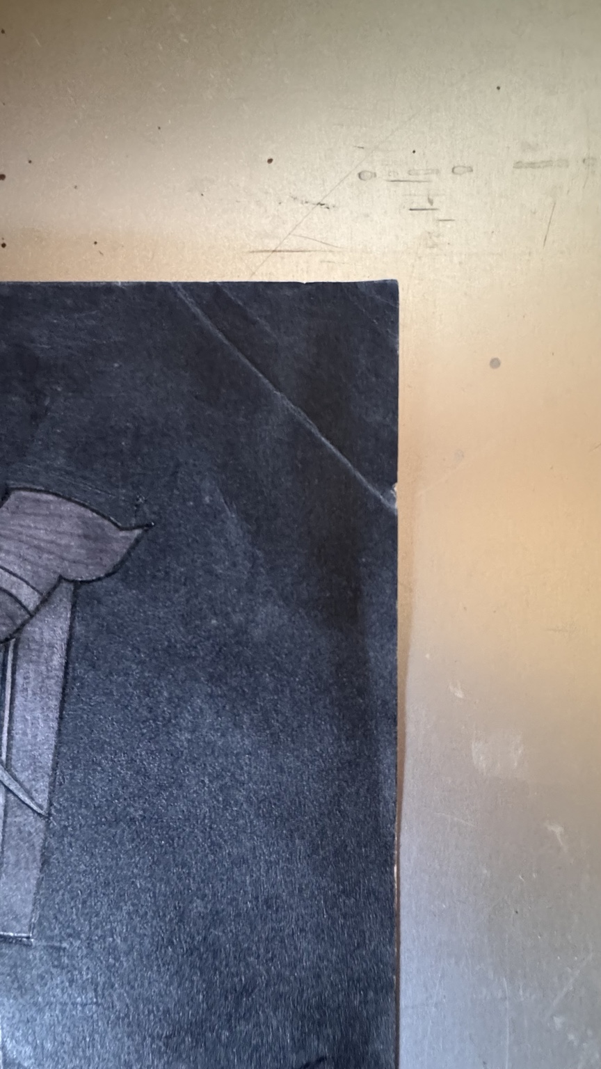 Dog-eared upper-right corner and crease in the original drawing.